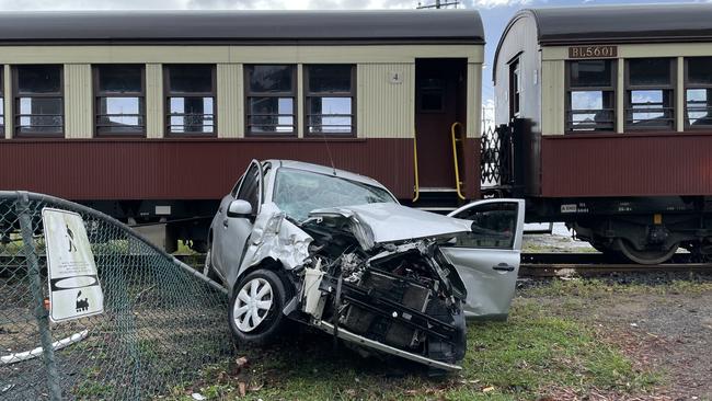 Paramedics transported a woman in her 20s to Cairns Hospital after her car crashed into the Kuranda Scenic Rail on Collins Ave in Edge Hill. Picture: Isaac McCarthy