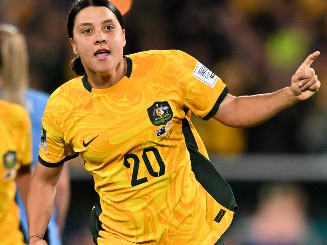 FILES-- This file photo taken on August 16, 2023 shows Australia's forward Sam Kerr celebrating scoring her team's first goal during the Australia and New Zealand 2023 Women's World Cup semi-final football match between Australia and England at Stadium Australia in Sydney. Chelsea and Australian women's football star Sam Kerr has been charged with a "racially aggravated offence" in Britain following a dispute involving a police officer, London's Metropolitan Police said March 4.  The 30-year-old striker, one of the highest profile and best-paid players in the women's game, was charged following an incident in London in January 2023, a police statement read. (Photo by IZHAR KHAN / AFP)