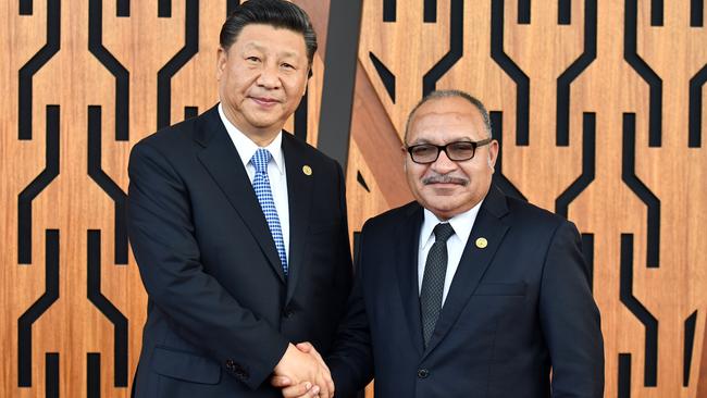 Then PNG Prime Minister Peter O'Neill (R) meets with China's President Xi Jinping During the APEC forum in Port Moresby, Papua New Guinea. Picture: AAP.