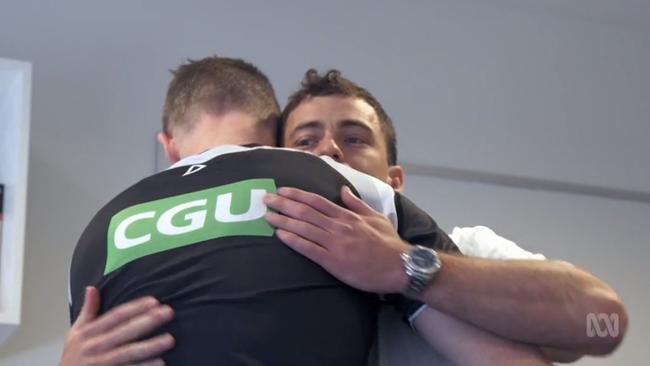 Nathan Buckley and Jarryd Blair hug it out.