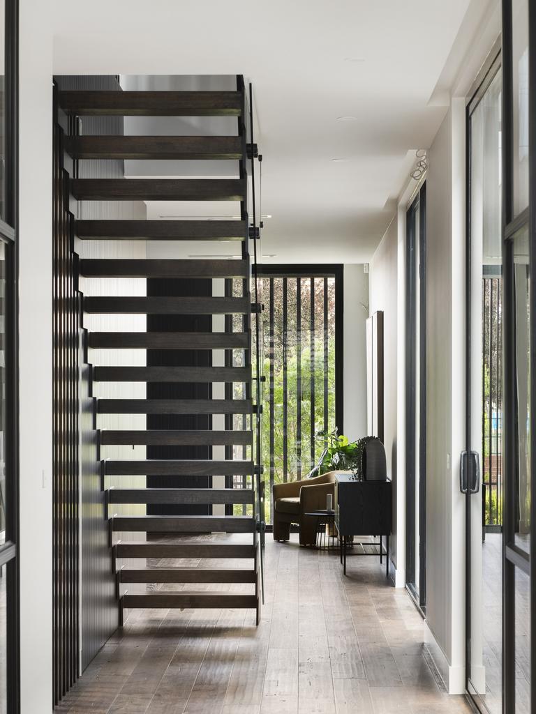 The home’s entrance allows for natural lighting to flow through the front door.