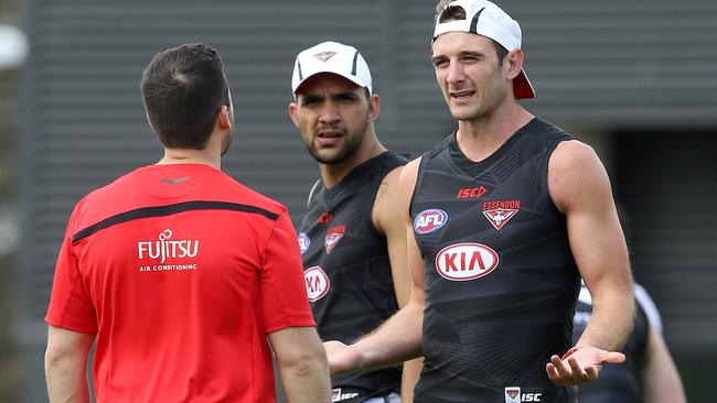 Jobe Watson talks with assistant coach Hayden Skipworth at Essendon training. Picture: Michael Klein