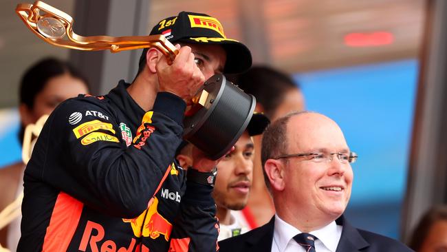 Ricciardo celebrates on the podium.