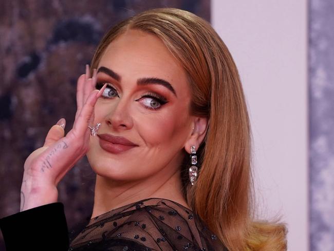 (FILES) British singer Adele Laurie Blue Adkins aka Adele poses on the red carpet upon her arrival for the BRIT Awards 2022 in London on February 8, 2022. A Brazilian judge has ordered a song by British pop superstar Adele, "Million Years Ago", be pulled globally -- including on streaming services -- over an ongoing plagiarism claim by a Brazilian composer. (Photo by Niklas HALLE'N / AFP) / RESTRICTED TO EDITORIAL USE â NO POSTERS â NO MERCHANDISEâ NO USE IN PUBLICATIONS DEVOTED TO ARTISTS