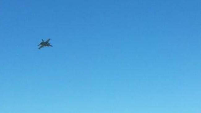 Marko Grady was quick enough to snap the RAAF hornet aircraft as it flew over the beach this morning.