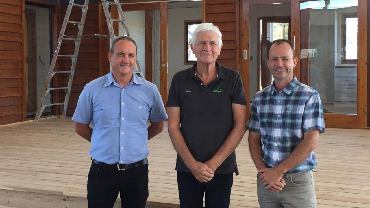 Department of Aigriculture's Bill Leggate, Eco Cottages head Greg Phipps and department project manager Dr Robbie McGavin with an Eco Cottage modular home under construction.