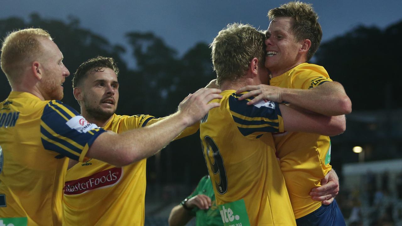 GOSFORD, AUSTRALIA - JANUARY 12: Matt Simon of the Central Coast Mariners celebrates a goal with team mate Michael McGlinchey during the round 14 A-League match between the Central Coast Mariners and the Melbourne Victory at Central Coast Stadium on January 12, 2020 in Gosford, Australia. (Photo by Tony Feder/Getty Images)