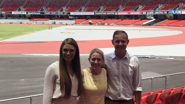 Bonney candidate Rowan Holzberger, Commonwealth Games Minister Kate Jones and Gaven candidate Meaghan Scanlon - at Carrara stadium where the Games athletics and Games Opening Ceremony will be held. The athletics track is being laid behind them.