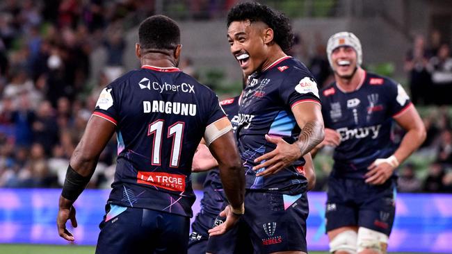 Rebels players celebrate a try scored by Filipo Daugunu this season. AFP