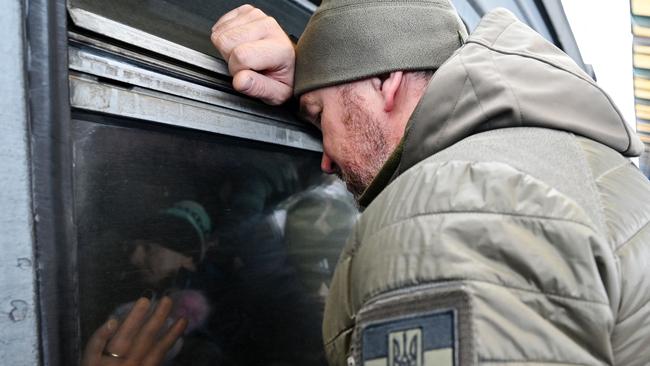 A man reacts in front of an evacuation train at Kyiv train station. Picture: AFP