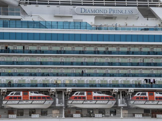 People stand on balconies on the Diamond Princess cruise ship. (Photo by Carl Court/Getty Images)