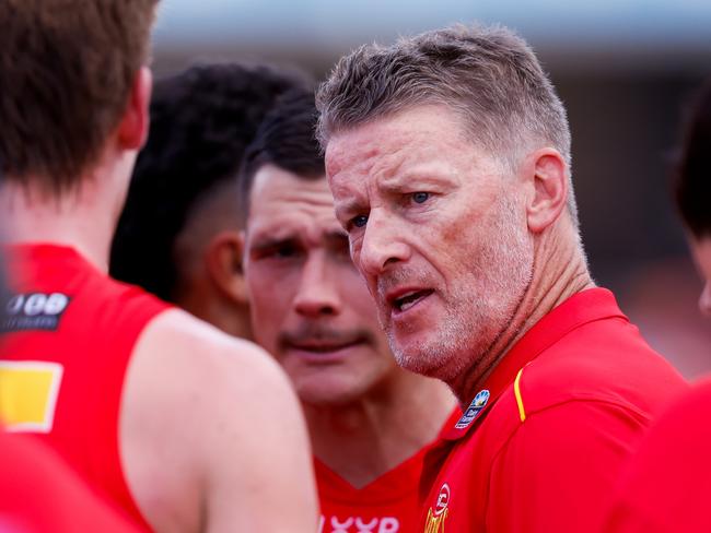 GOLD COAST, AUSTRALIA - MARCH 09: Damien Hardwick, Senior Coach of the Suns addresses his players at quarter time during the 2024 AFL Opening Round match between the Gold Coast SUNS and the Richmond Tigers at People First Stadium on March 09, 2024 in Gold Coast, Australia. (Photo by Dylan Burns/AFL Photos via Getty Images)