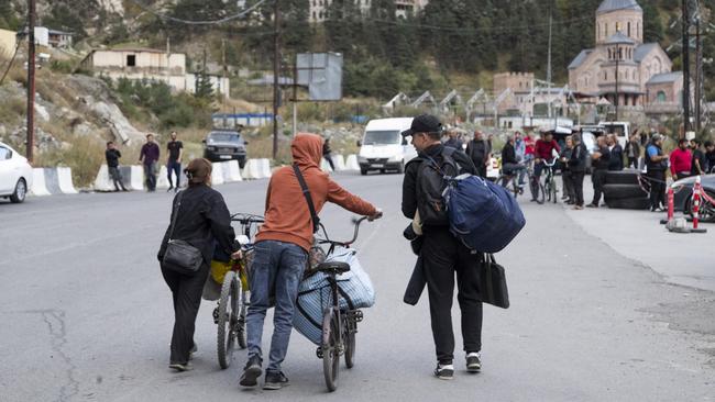 Russians are pictured fleeing to neighbouring countries, as support for negotiations to end the nine-month conflict rises from 32 per cent to 55 per cent. Picture: Getty