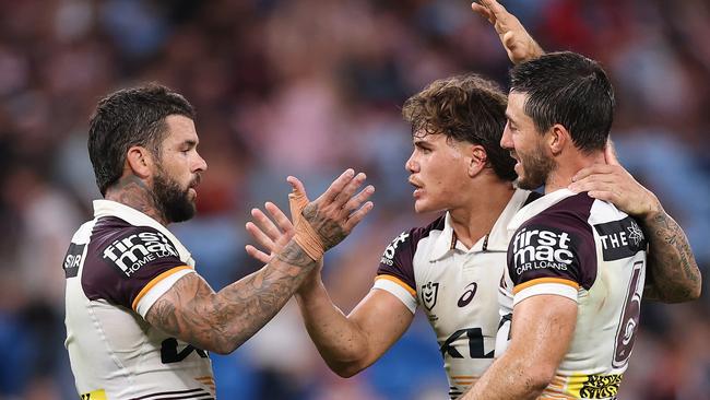 SYDNEY, AUSTRALIA - MARCH 06: AdamÃÂ Reynolds, Ben Hunt and Reece Walsh of the Broncos celebrate winning the round one NRL match between Sydney Roosters and Brisbane Broncos at Allianz Stadium on March 06, 2025, in Sydney, Australia. (Photo by Cameron Spencer/Getty Images)