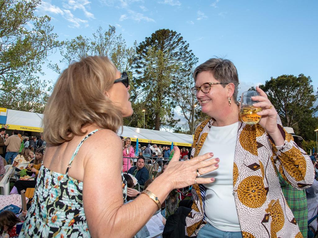 Lyn Dunkley (left) and Simone Redwood dancing to the INXS tribute band INXSIVE at the Festival of Food and Wine, Queens Park, Toowoomba Carnival of Flowers. Saturday September 10, 2022 Picture: Bev Lacey