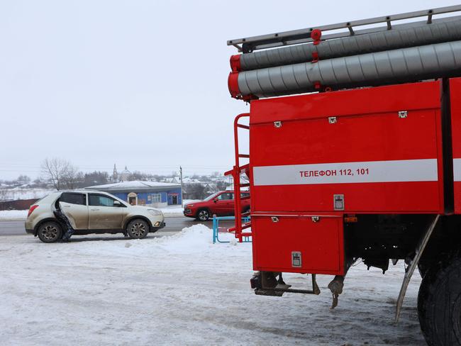 A fire engine is seen in the village of Yablonovo near the Russian IL-76 military transport plane crash site in the Belgorod region. Picture: AFP