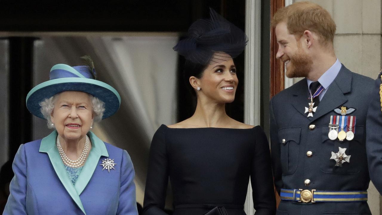 Britain&#039s Queen Elizabeth II, and Meghan the Duchess of Sussex and Prince Harry. Picture: AP