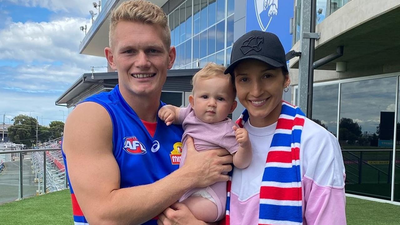 Ex-Collingwood star Adam Treloar, partner Kim Ravaillion and daughter Georgie are now part of the Western Bulldogs family.