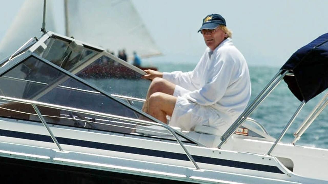 The late Ron Walker watching the Couta Boat Race at Sorrento in terry-towelling dressing gown or robe.