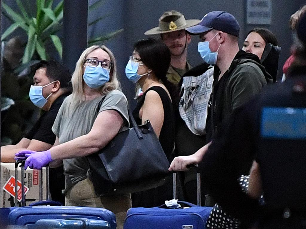 Returning overseas travellers check in to an airport hotel in Brisbane where they will spend 14 days of quarantine. Picture: Dan Peled/AAP