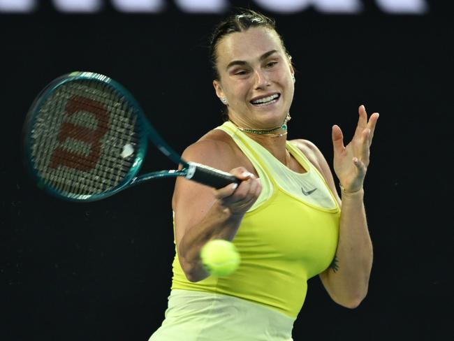 MELBOURNE, AUSTRALIA - JANUARY 12: Aryna Sabalenka plays a forehand against Sloane Stephens of the United States in the Women's Singles First Round match during day one of the 2025 Australian Open at Melbourne Park on January 12, 2025 in Melbourne, Australia. (Photo by Quinn Rooney/Getty Images)