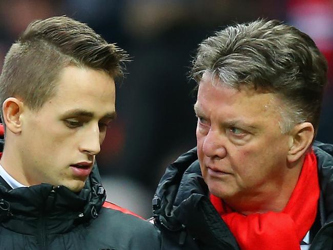 MANCHESTER, ENGLAND - FEBRUARY 28: Manager Louis van Gaal of Manchester United speaks to Adnan Januzaj of Manchester United at half time during the Barclays Premier League match between Manchester United and Sunderland at Old Trafford on February 28, 2015 in Manchester, England. (Photo by Alex Livesey/Getty Images)