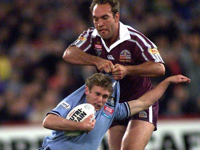 Gorden Tallis manhandles Brett Hodgson in tackle and into touch during Game 3 of of NSW v Queensland State of Origin series at Stadium Australia, Olympic Park, Homebush in Sydney.