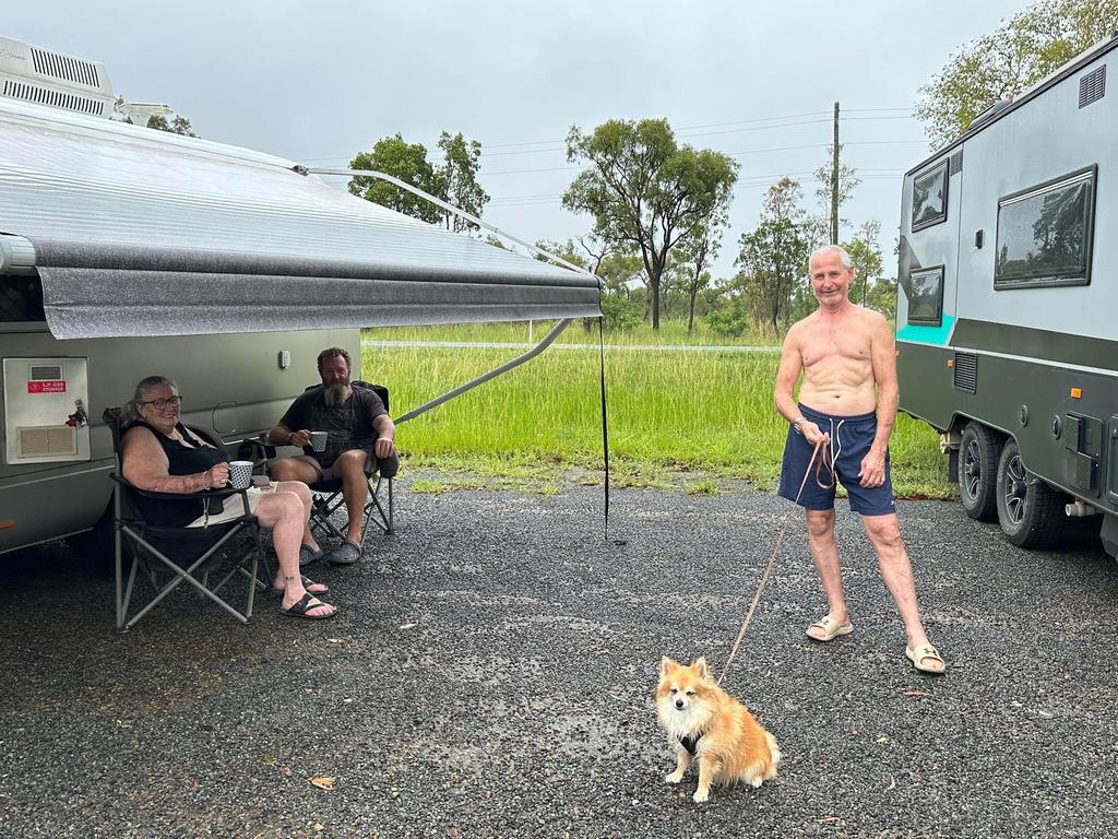 Yeppoon couple Leanne Sampson and Hugh Lane with Cairns resident Stephen Coates with his Pomeranian companion, Chino, camped out at Lethebrook after the highway was cut because of rain. Picture: Heidi Petith