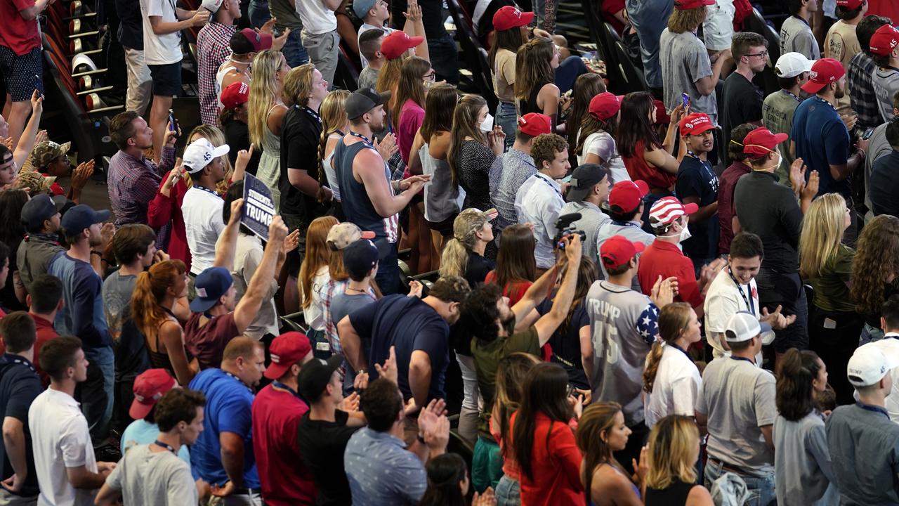 Supporters applaud Donald Trump at the Phoenix rally. Picture: Evan Vucci/AP