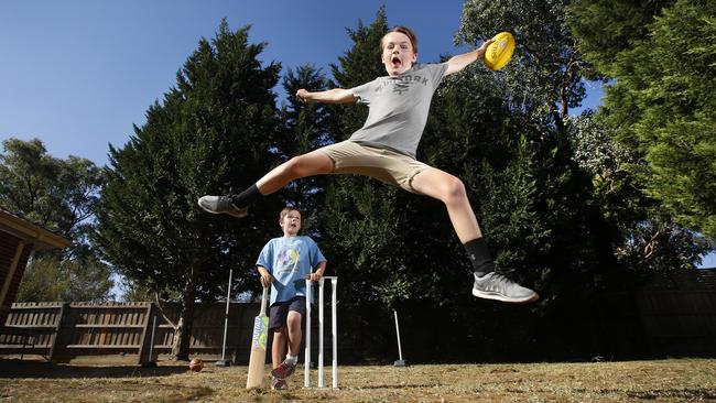 Australians have been told to get over their obsession with the quarter acre block and embrace high density living. Meanwhile Jake, 8, and his brother Ethan, 12, enjoy playing sports in the their big backyard. Picture: David Caird