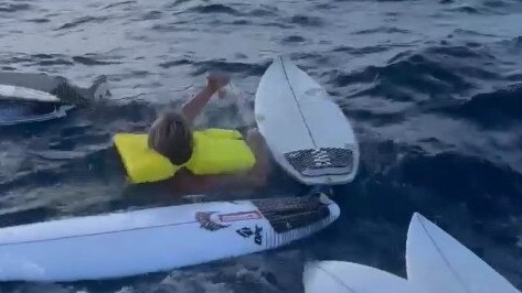 Some in the group gathered surfboards to which the surfers tied themselves in case the boat sank.