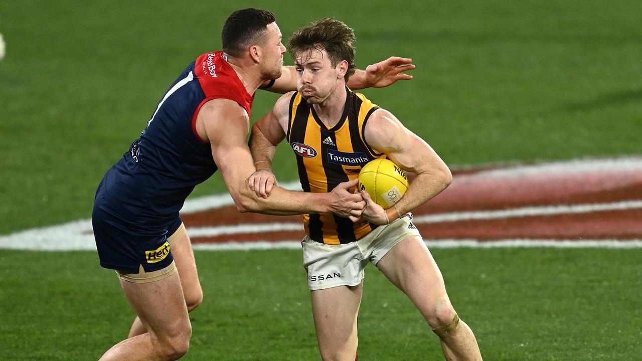 Lachlan Bramble of the Hawks is tackled by Steven May of the Demons. Picture: Quinn Rooney