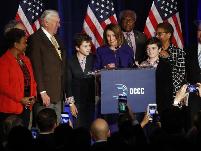 House Minority Leader Nancy Pelosi of California - soon expected to be House Majority Leader - (centre) speaks between two of her grandsons and Democrat heavyweights as they celebrate Democratic wins in the House of Representatives. Picture: AP Photo/Jacquelyn Martin