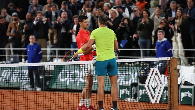 The two fierce rivals share a handshake at the net after the battle. Picture: Clive Brunskill/Getty Images