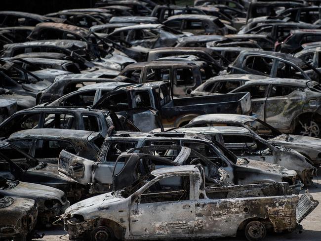 Burnt cars parked outside a football stadium following a wildfire at the village of Rafina, near Athens. Picture: AFP