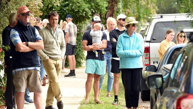 A crowd of mostly neighbours watched the auction.