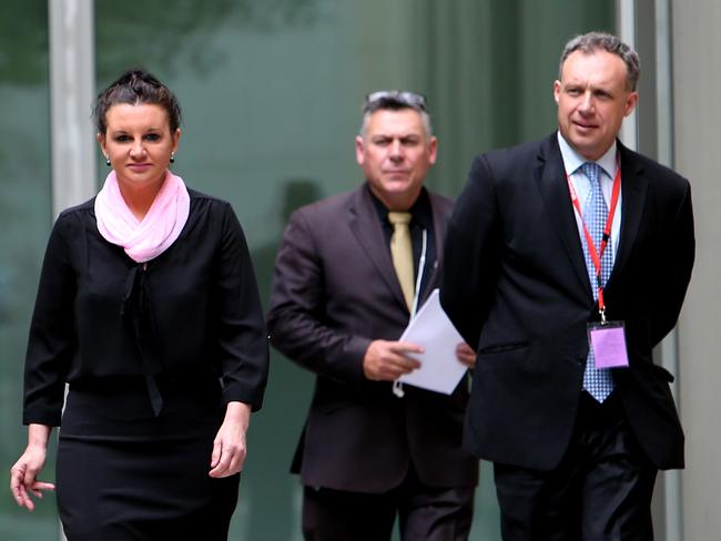 Senator Lambie with Mr Messenger and her lawyer Glynn Williams before speaking at a press conference in Canberra.