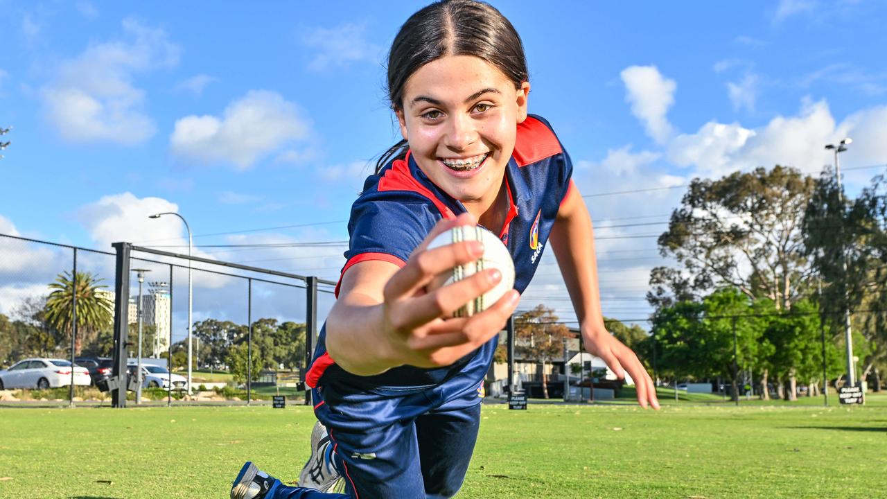 Lillian Thomas takes a diving catch at state cricket training. Picture: Brenton Edwards