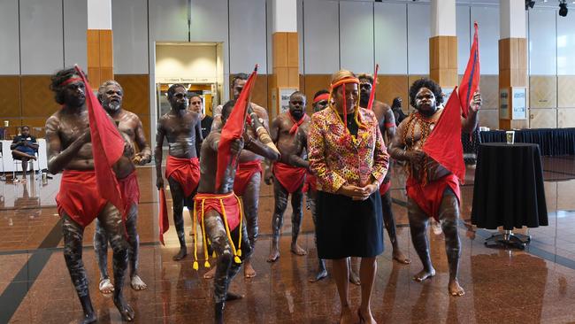 Member for Arnhem Selena Uibo with dancers entering parliament. Picture Katrina Bridgeford.