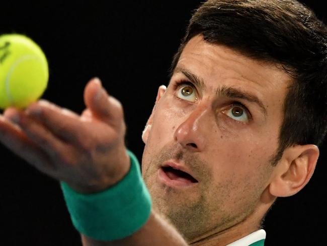 (FILES) In this file photo taken on February 21, 2021 Serbia's Novak Djokovic serves against Russia's Daniil Medvedev during the men's singles final on day fourteen of the Australian Open tennis tournament in Melbourne. - Novak Djokovic received "no special" favours to be granted a Covid vaccine exemption to play at the Australian Open, said tournament chief Craig Tiley on January 5, 2022, as the move sparked a furious backlash. (Photo by Paul CROCK / AFP) / -- IMAGE RESTRICTED TO EDITORIAL USE - STRICTLY NO COMMERCIAL USE --