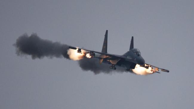 A Chinese J-11 strike fighter opens fire during military exercises last year. Beijing has announced it will now conduct drills within the South China Sea ‘monthly’.