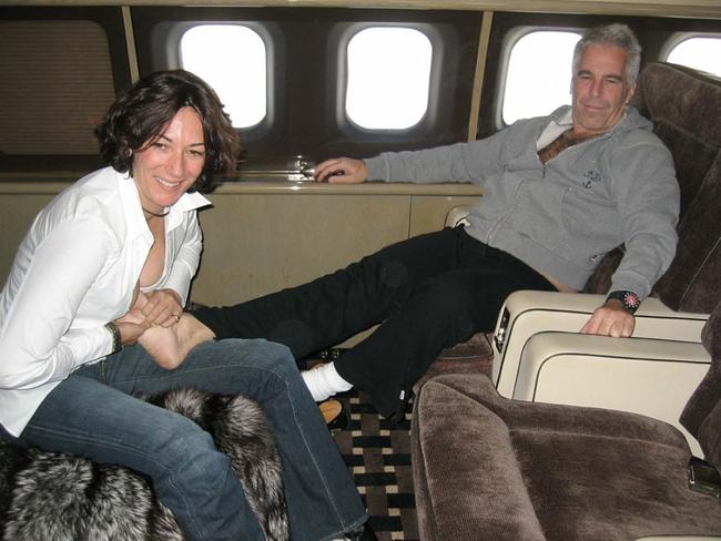 Ghislaine Maxwell massages the feet of Jeffrey Epstein. Picture: AFP