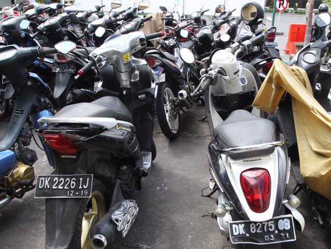 The motorbike on the right belonged to deceased Balinese police officer Wayan Sudarsa and the bike on the left is the one rented in Jimbaran Bay by David Taylor and Sara Connor. Picture: Lukman S. Bintoro.