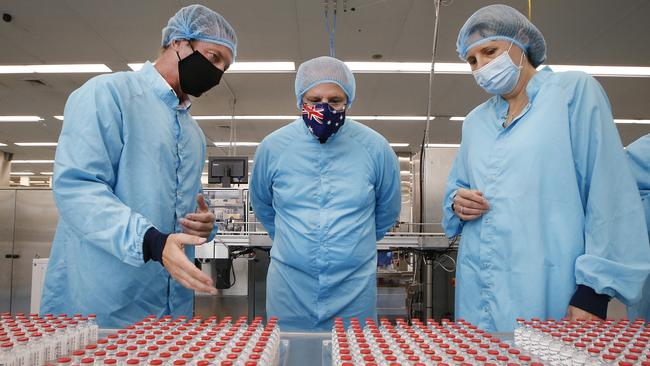 Prime Minister Scott Morrison visit to CSL serum lab to inspect COVID-19 Immunoglobulin being produced in Parkville Melbourne. The PM is shown trial vials of the AstraZeneca vaccine.   Picture: David Caird POOL IMAGES