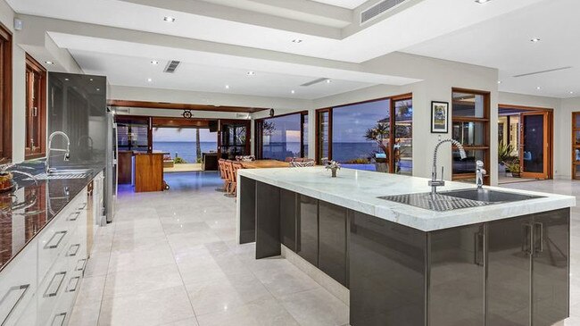 The kitchen and living area of the property at 32 Sentinel Court, Raby Bay.