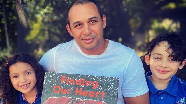 Author Thomas Mayor with daughter Ruby (L) and son William (R), with the children’s version of his book Finding the Heart of the Nation. Picture: Melanie Mayor.