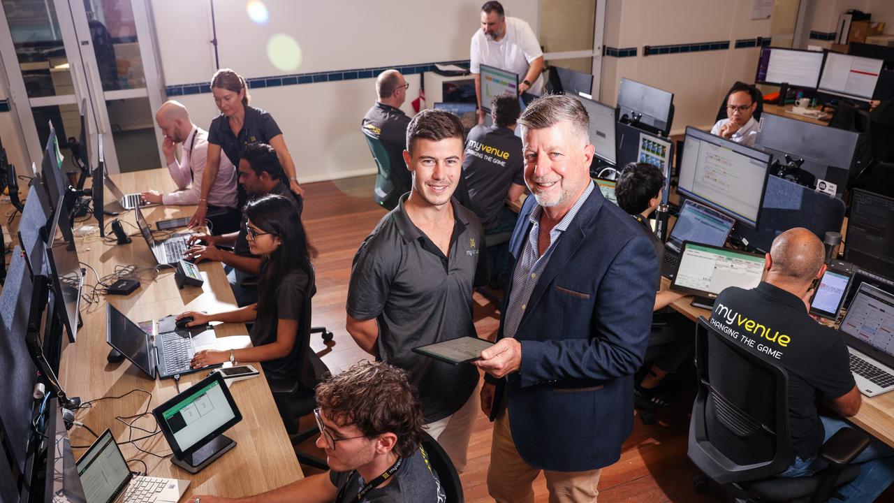 MyVenue chief executive Tim Stollznow, right, with developer Angus Juers and the MyVenue team. Picture: Supplied