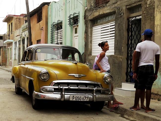 Much time is spent hanging in the streets in Santiago de Cuba. Picture: John Barker