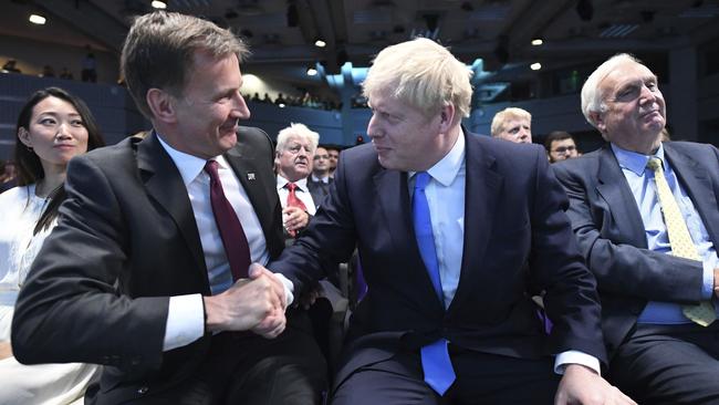 Jeremy Hunt, left, congratulates Boris Johnson after the announcement of the result in the ballot for the new Conservative Party leader, in London. Picture: AP