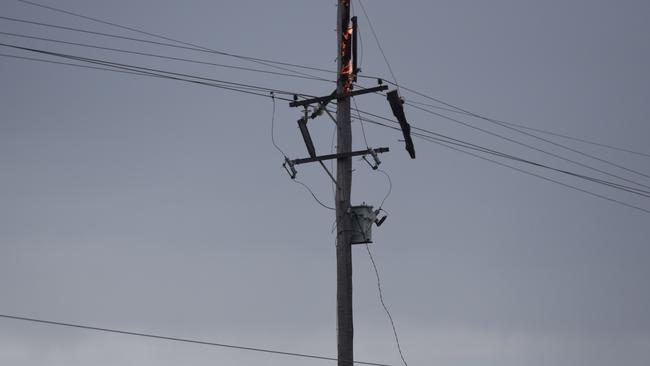 A power pole has caught on fire.